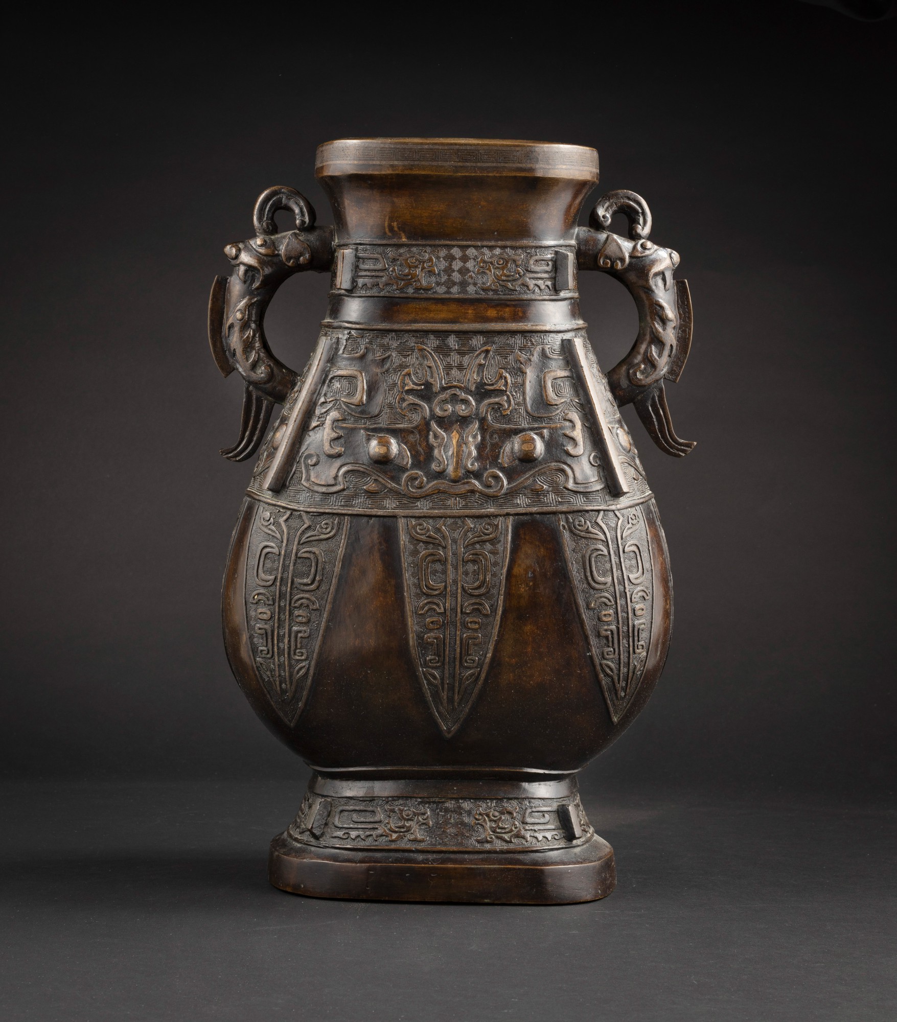 Unknown — 清十八世紀 銅仿古紋獸耳方壺