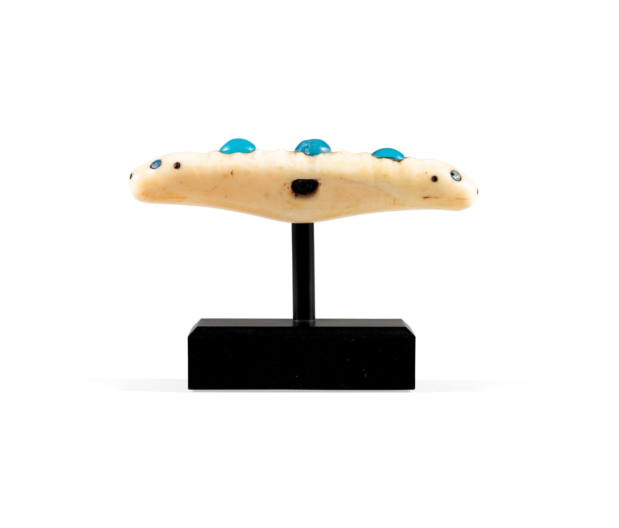 Inuit walrus ivory seal-head amulet, Alaska