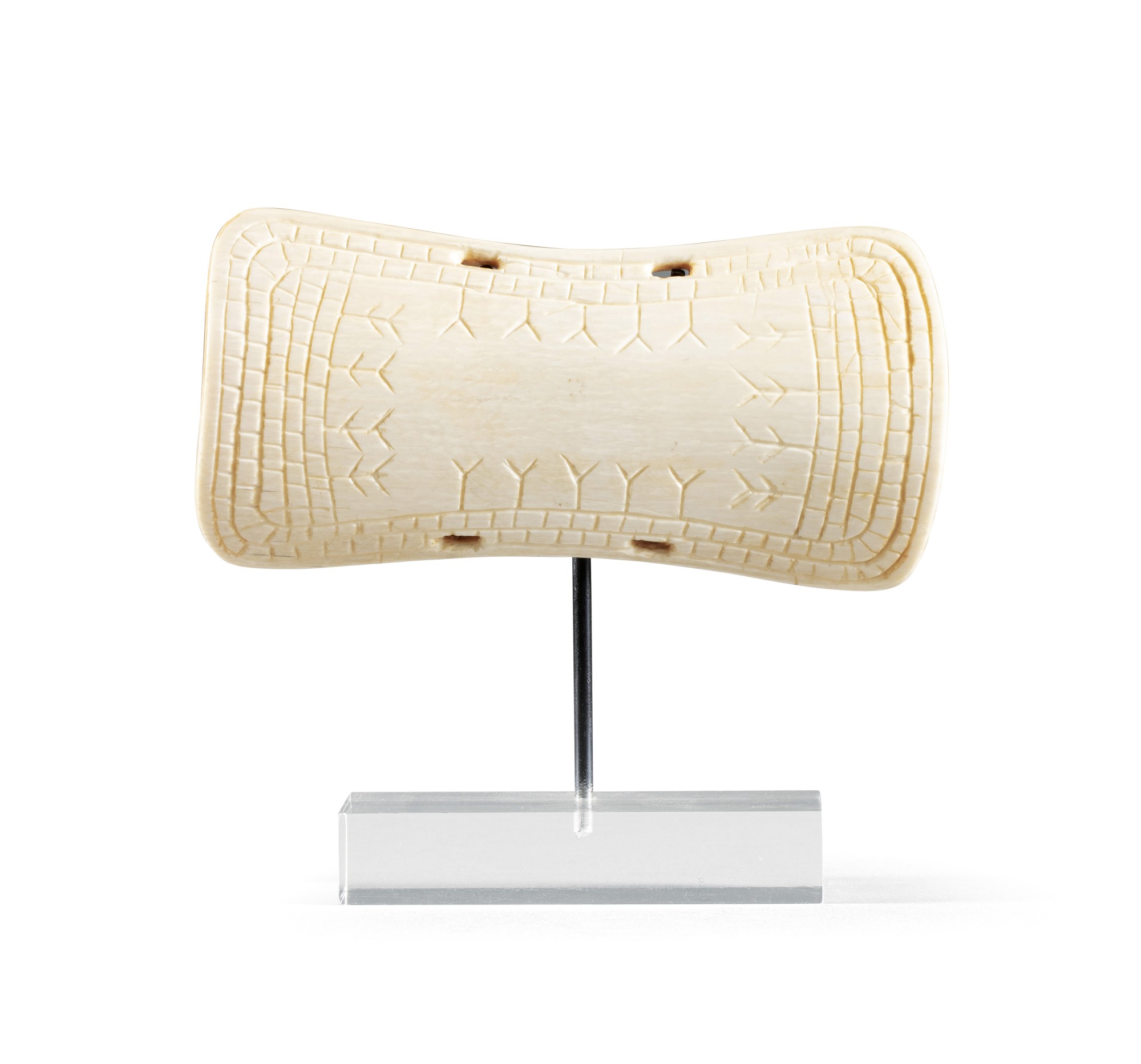 An Inuit walrus ivory wrist guard, Alaska — An Inuit walrus ivory wrist guard, Alaska