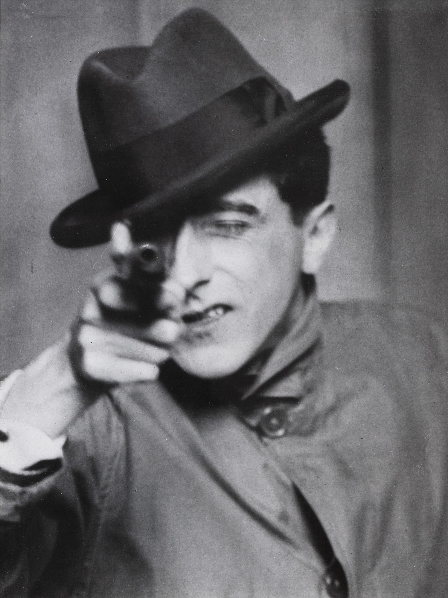 Berenice Abbott — Jean Cocteau with Gun, Paris, 1927