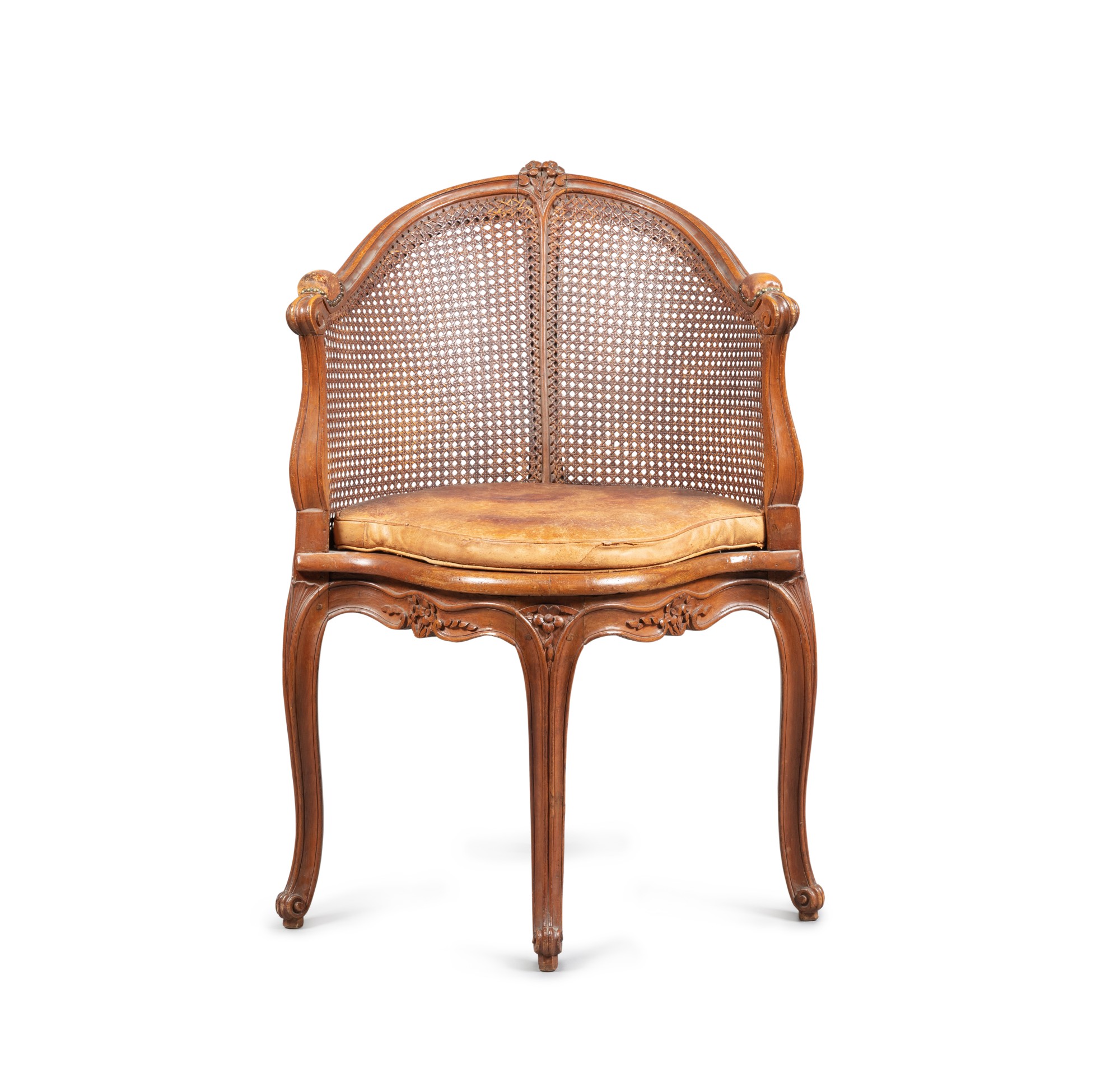 A Louis XV style caned and carved desk armchair — Fauteuil de bureau cané et sculpté, de style Louis XV