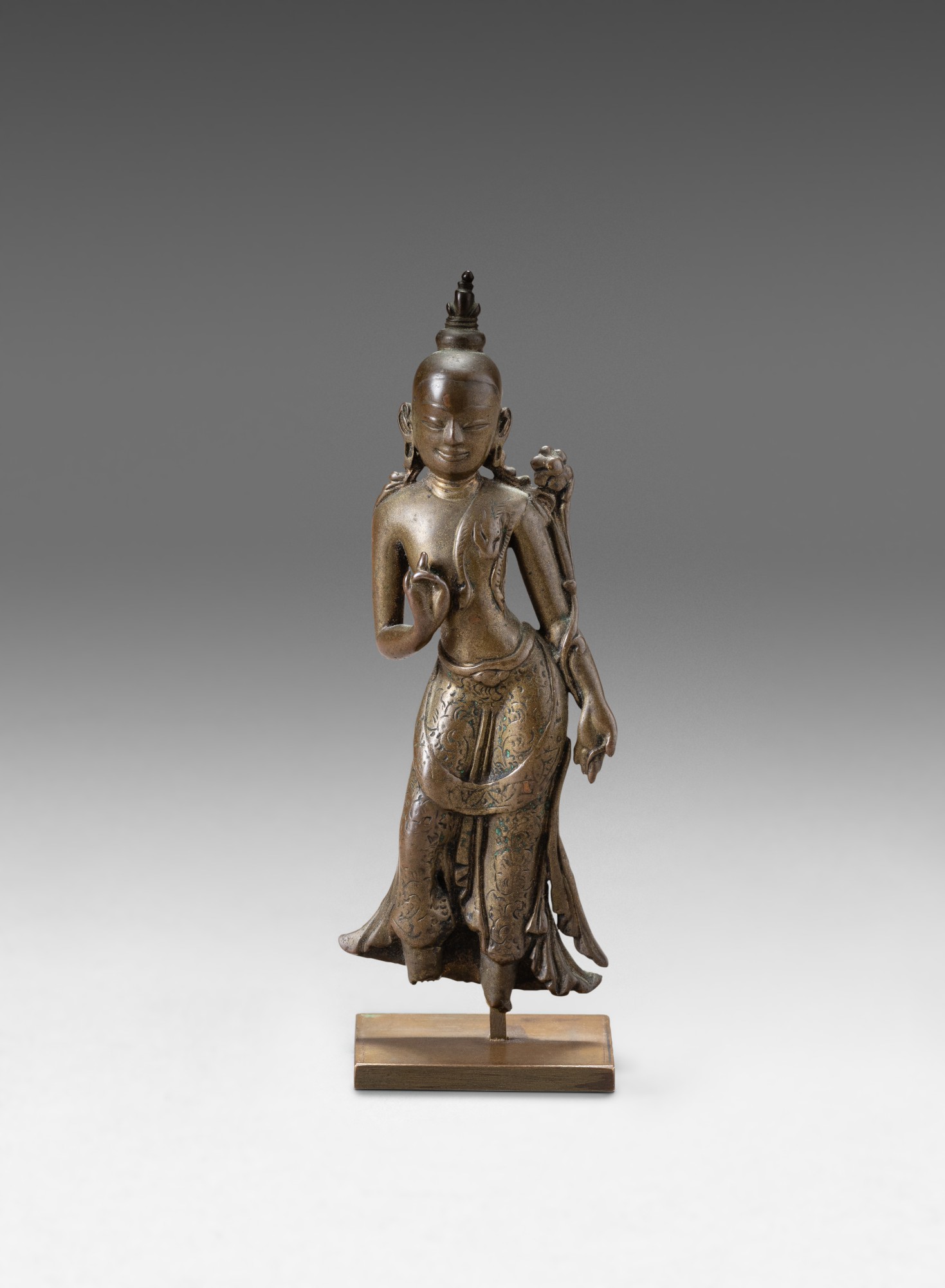 A bronze figure of Maitreya — 西藏 約十三世紀 銅彌勒佛立像