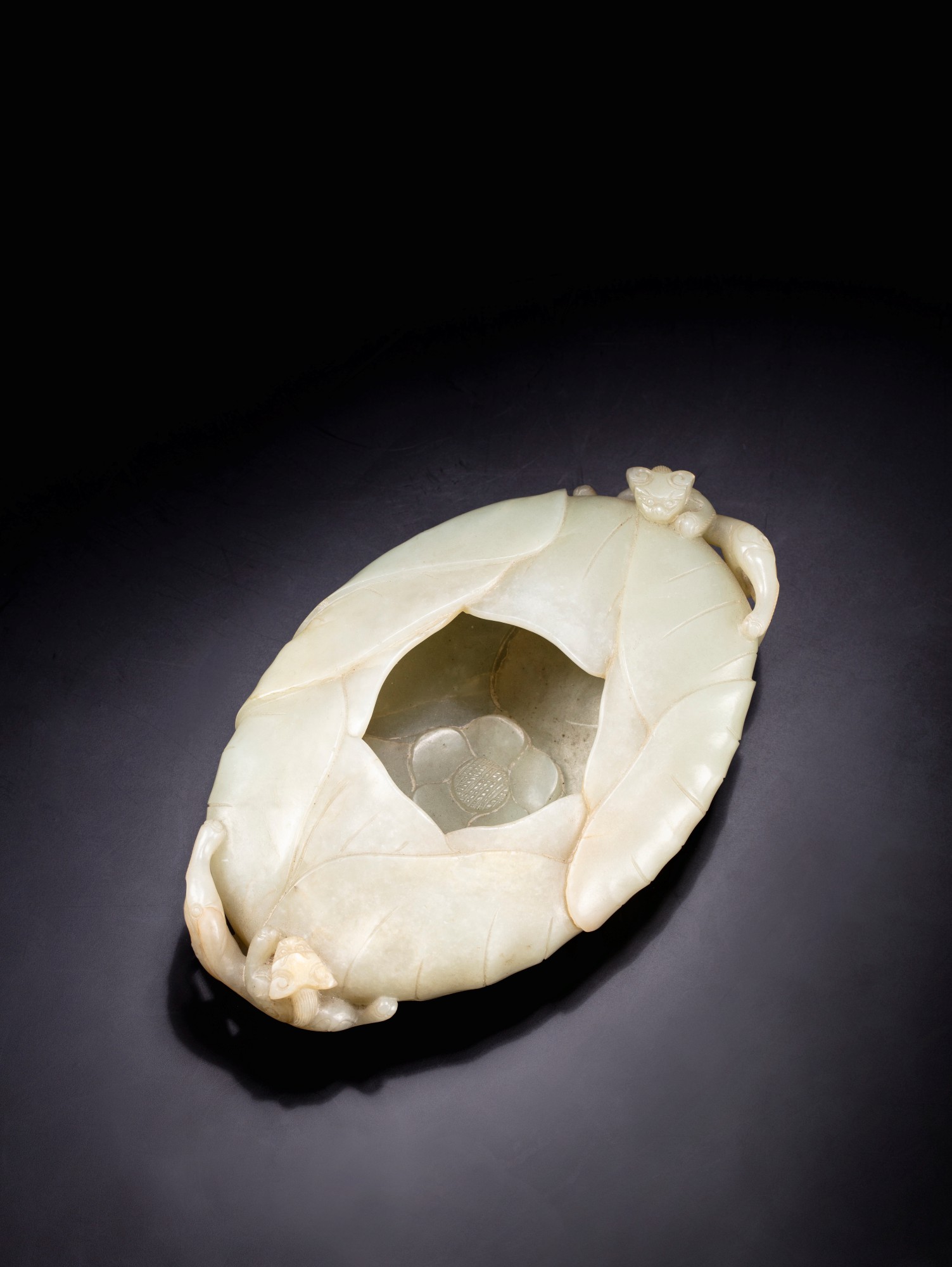 A pale celadon jade 'chilong' brush washer — 清十八世紀 青白玉螭龍紋蓮式洗