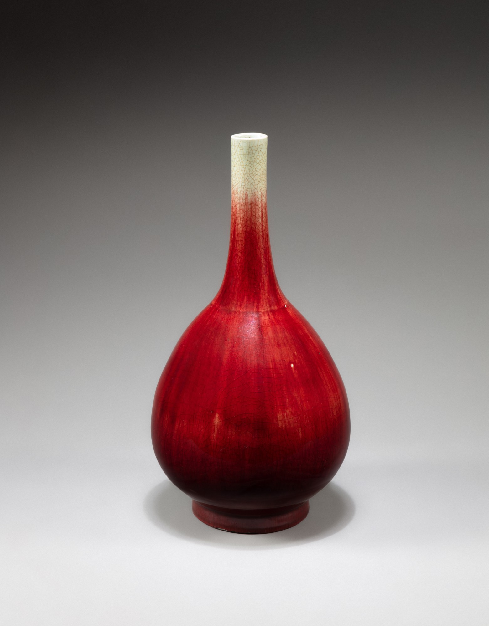 A large copper-red-glazed bottle vase — 清十八世紀 郎窰紅釉長頸瓶