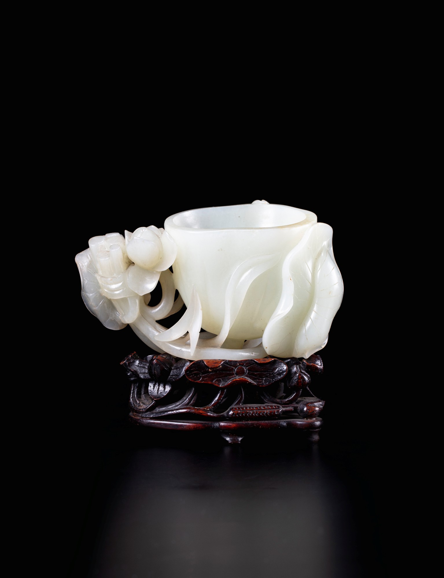 A pale celadon jade lotus-shaped brush washer — 清乾隆 青白玉蓮式洗