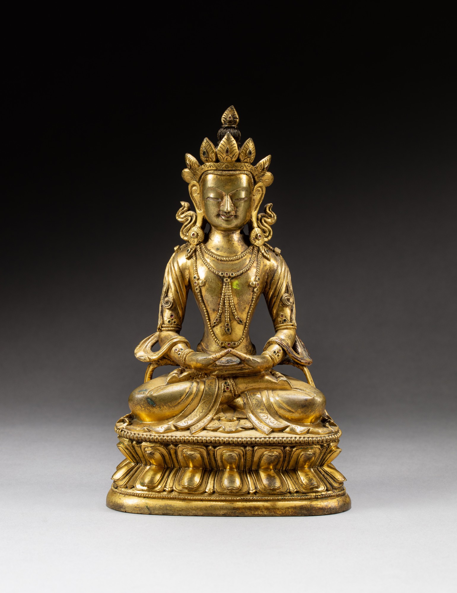 A gilt-bronze figure of Amitayus — 清十八至十九世紀 鎏金銅無量壽佛坐像