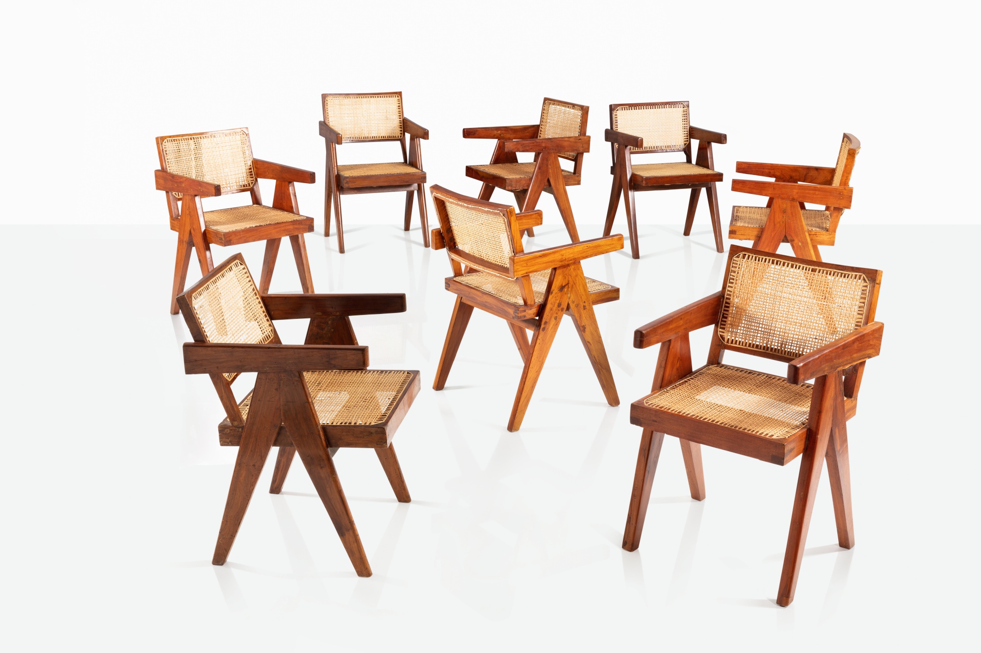 Pierre Jeanneret — Suite de huit fauteuils dits Office cane chairs 