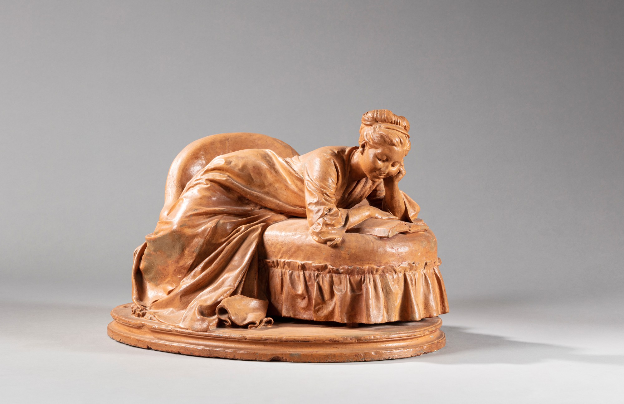 Jules Dalou — La Liseuse étendue sur un canapé (Woman Reading on a couch)