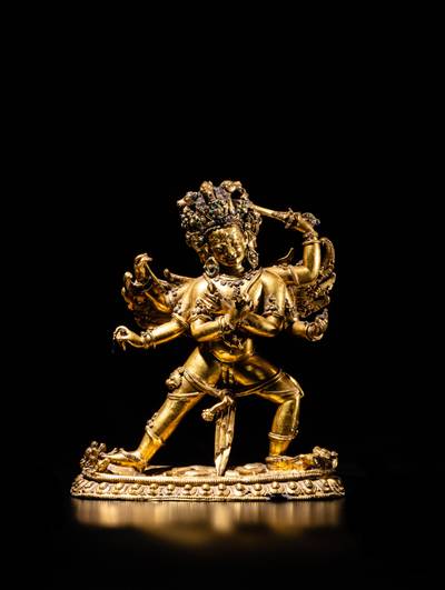 An extraordinary gilt-bronze figure of Hayagriva