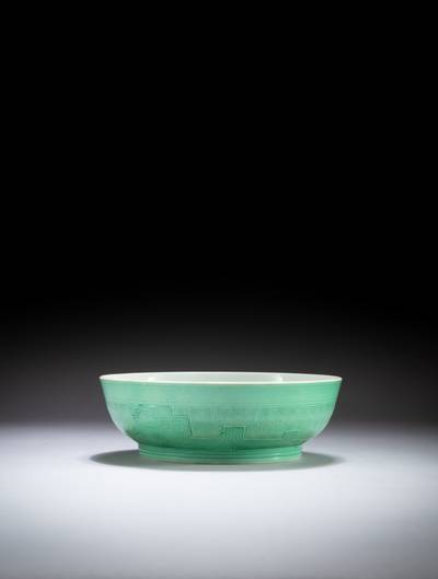 An archaistic carved green glazed dish