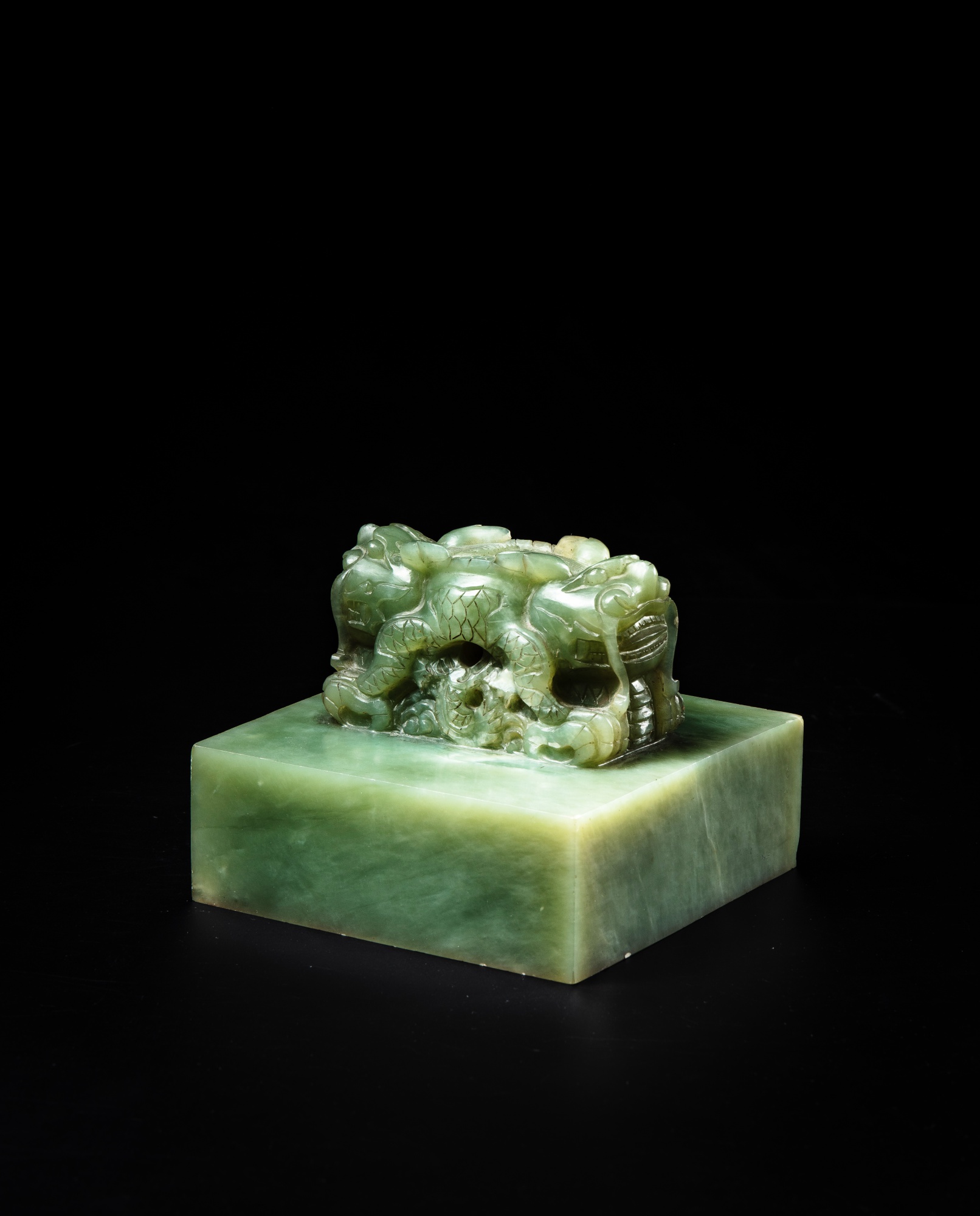 A large celadon jade 'dragon' seal — 清光緒 青玉龍紐璽