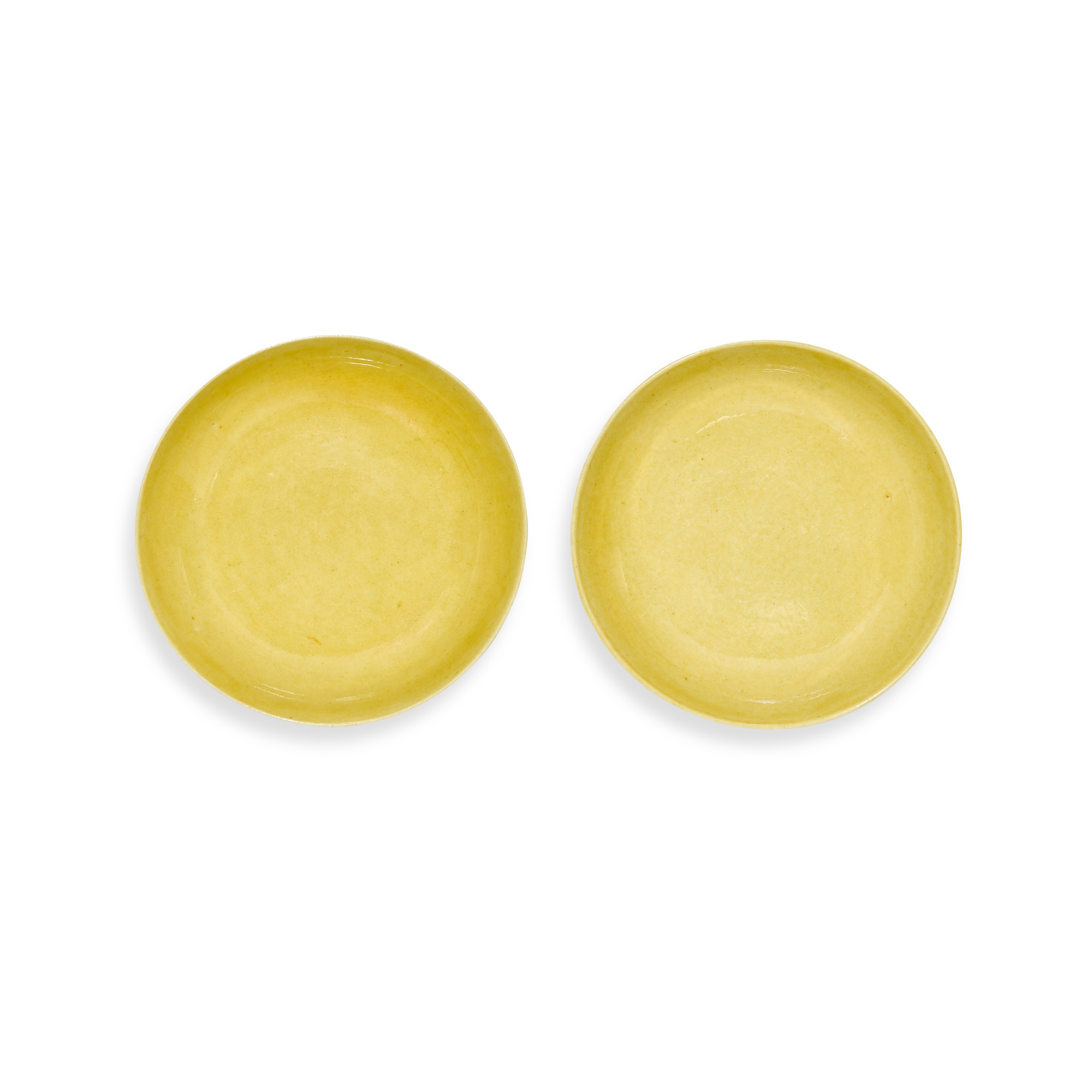 A pair of yellow-glazed saucers — 清光緒 黃釉盤一對 《大清光緒年製》款