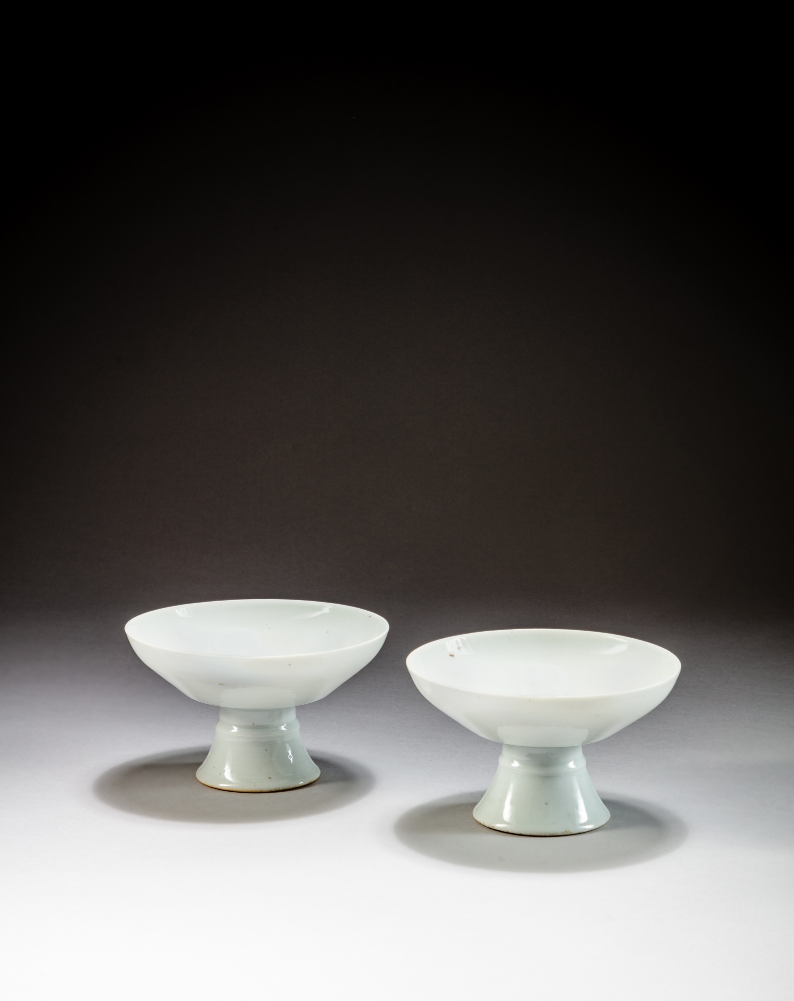 Two white-glazed stembowls