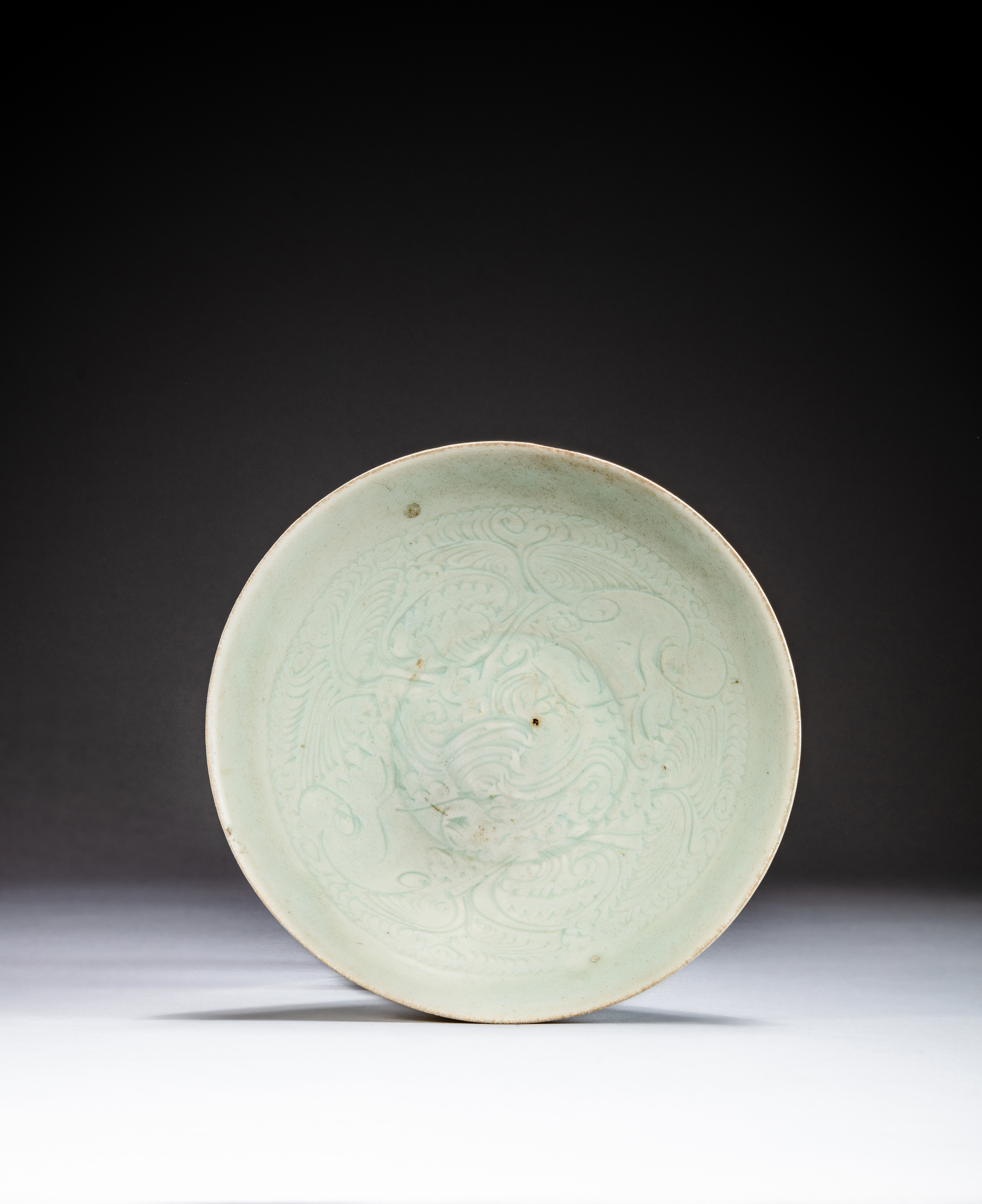 A carved Qingbai bowl — 宋 青白釉刻花卉紋盌