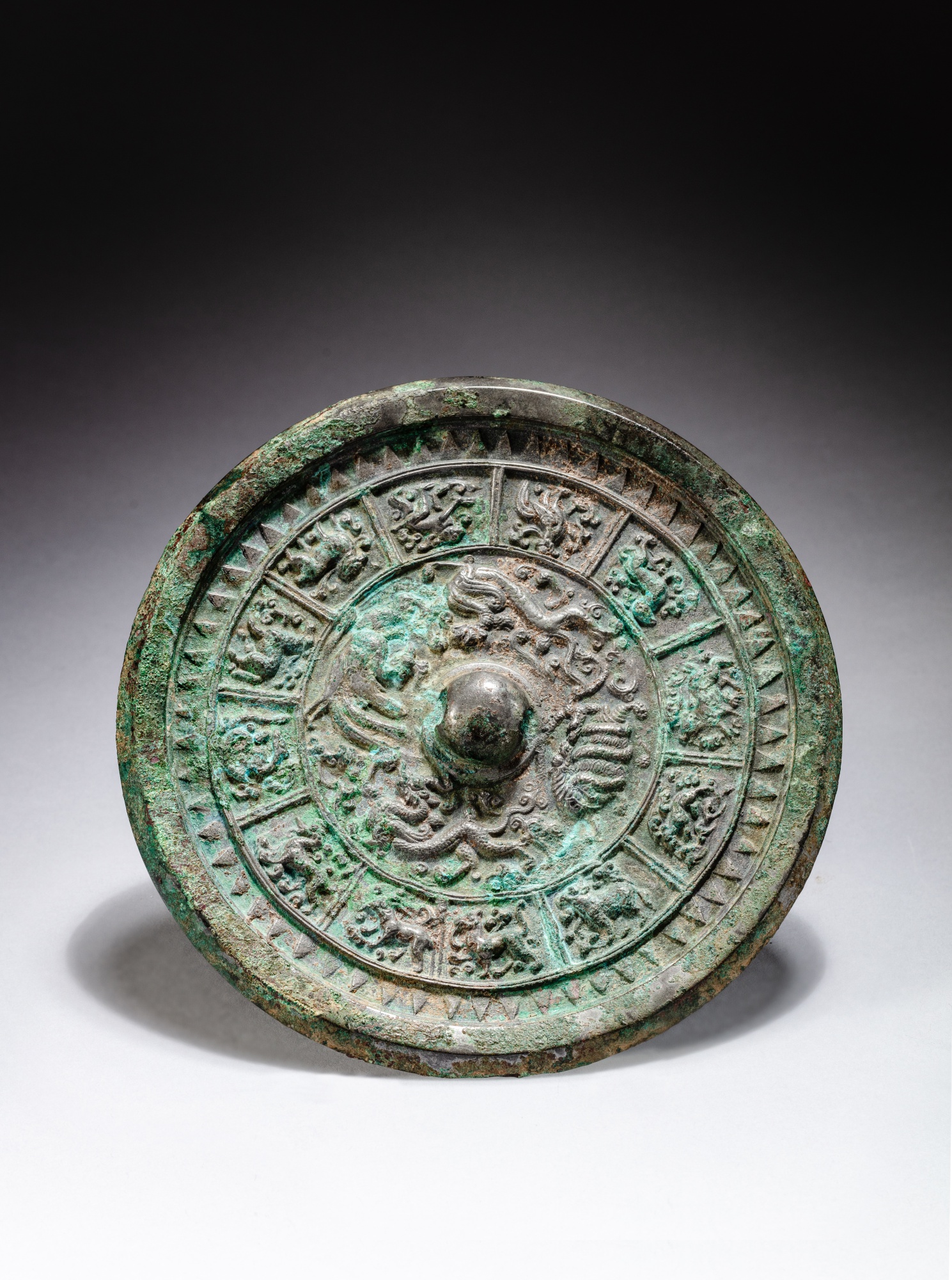 A silvery bronze 'zodiac' mirror — 唐 銅鎏銀十二生肖紋鏡