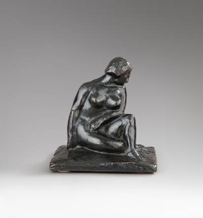 Woman sitting on the ground