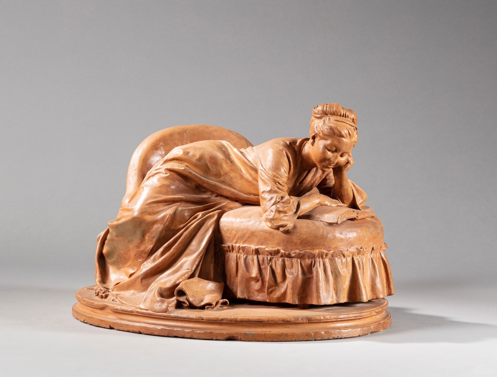 Jules Dalou — Woman reading on a couch