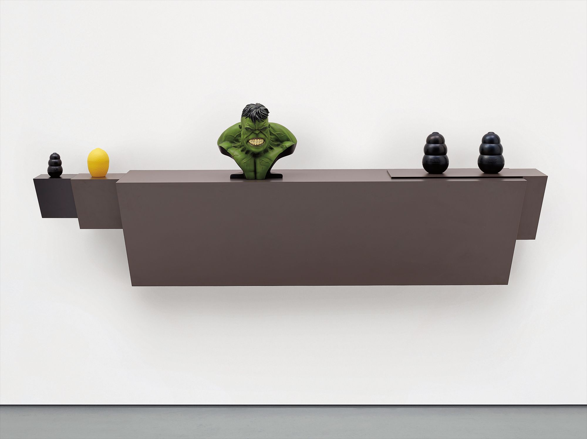 Haim Steinbach — plastic laminated wood shelf, small rubber dog chew, plastic lemon/lime saver, polystone 'Hulk' bust, 2 large rubber dog chews