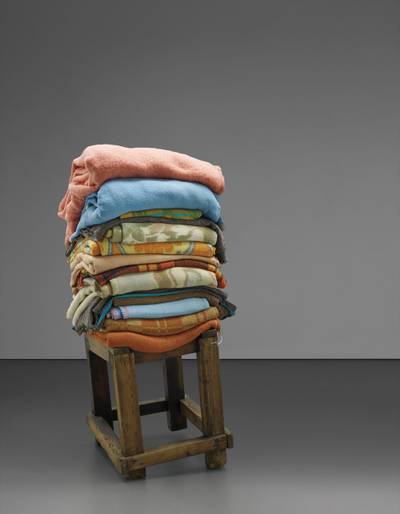wooden stool and blankets