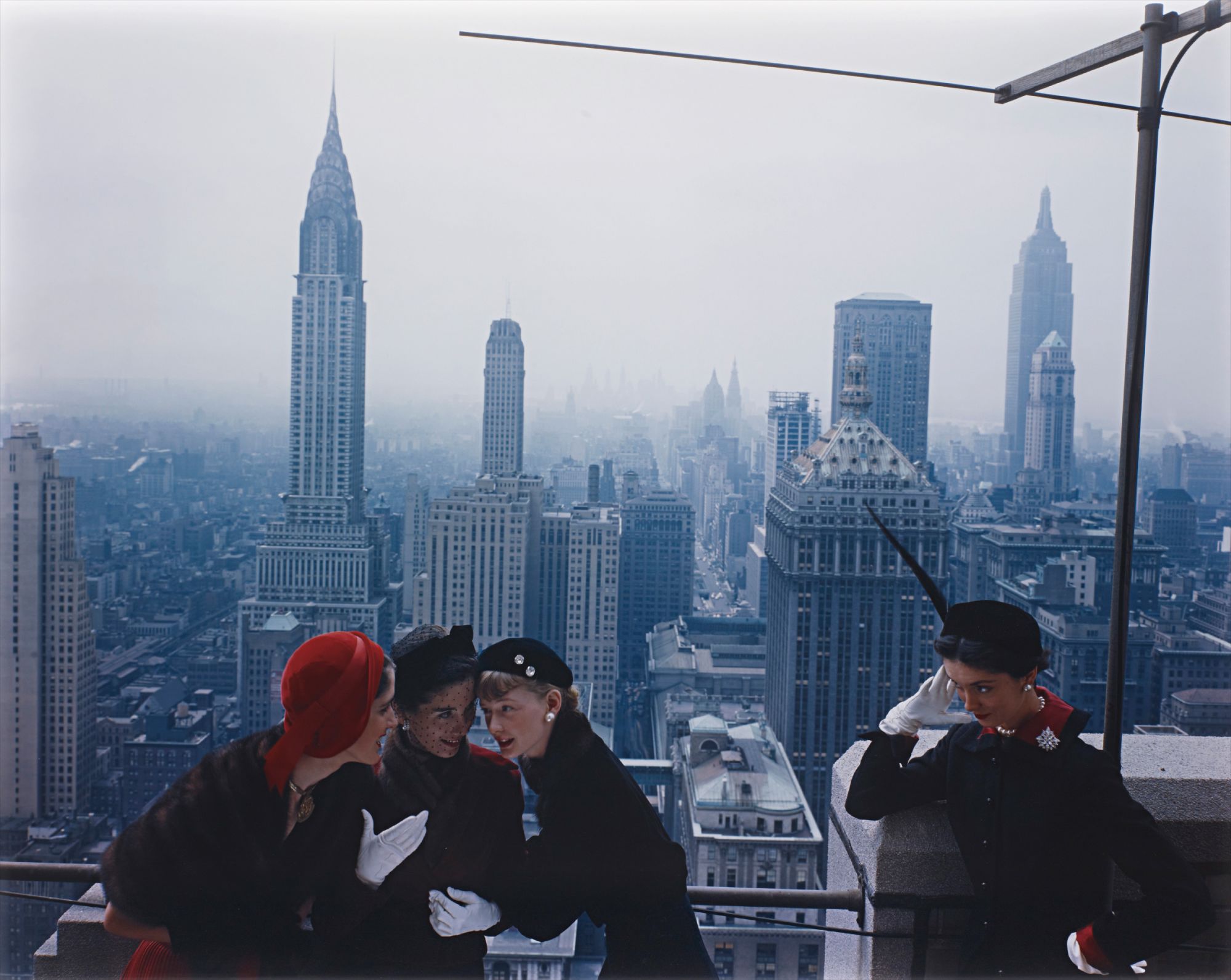 Hat fashions, the New York skyline from the roof of the Condé Nast building on Lexington Avenue