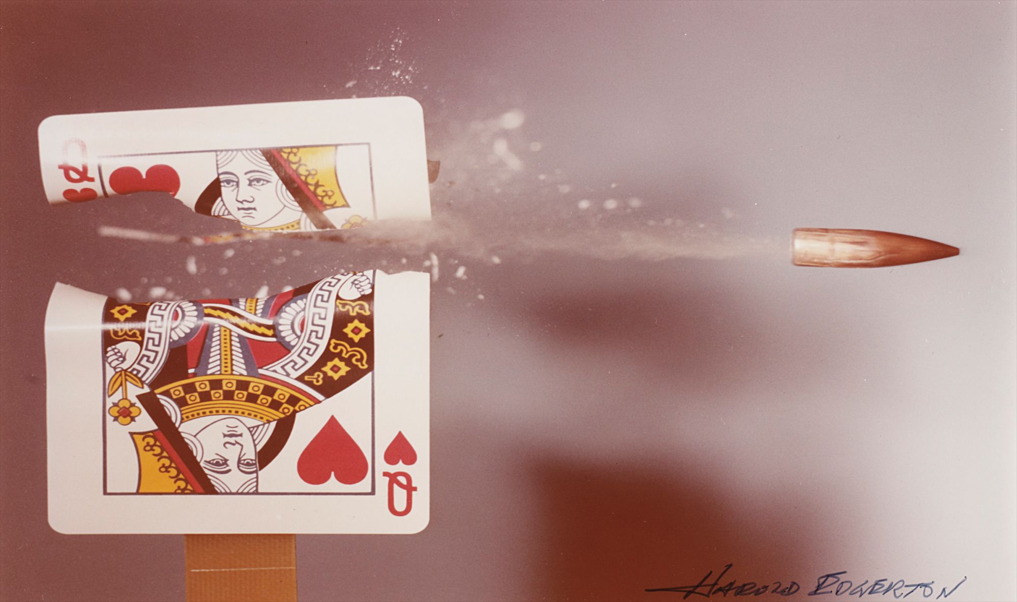 Queen of Hearts playing card hit by a .30 calibre bullet