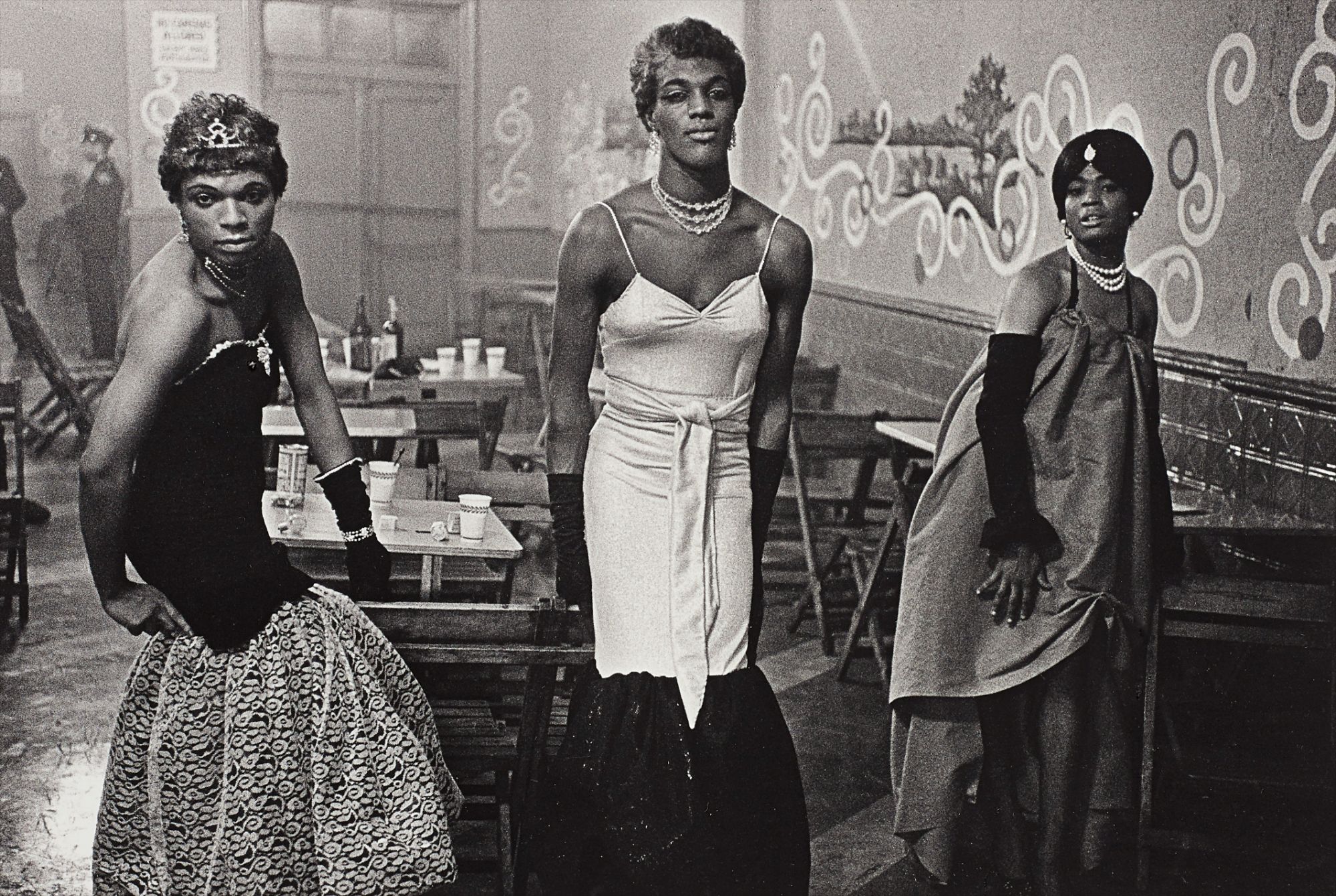 Diane Arbus — Three transvestites in evening dress at a lounge, N.Y.C.