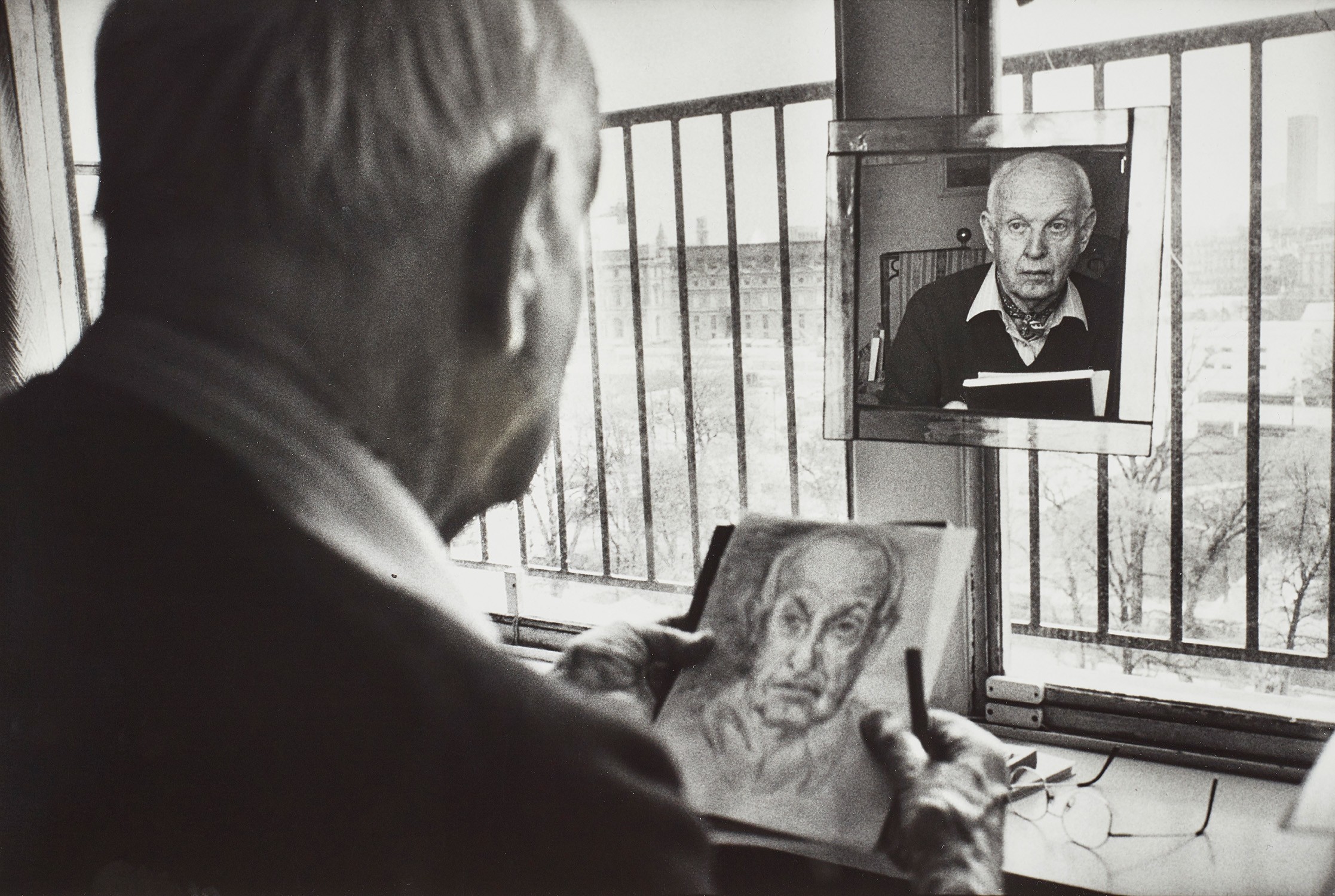 Henri Cartier-Bresson drawing a self-portrait in his studio