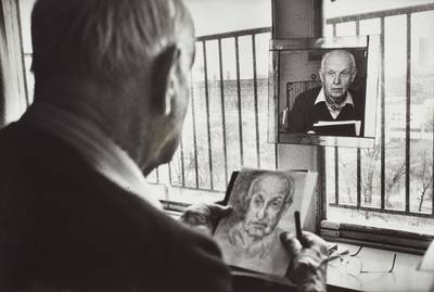 Henri Cartier-Bresson drawing a self-portrait in his studio