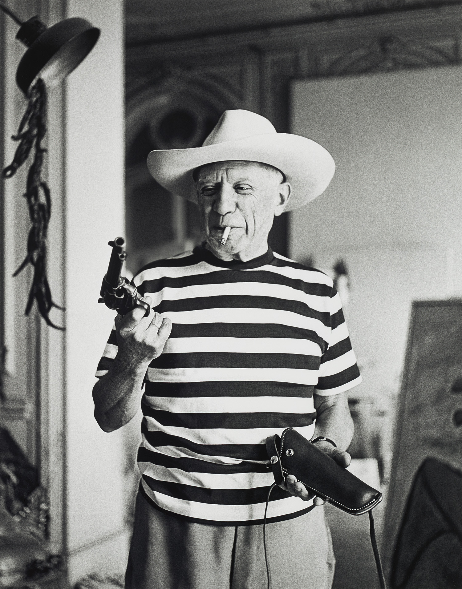 André Villers — Picasso with the revolver and hat gifted by Gary Cooper