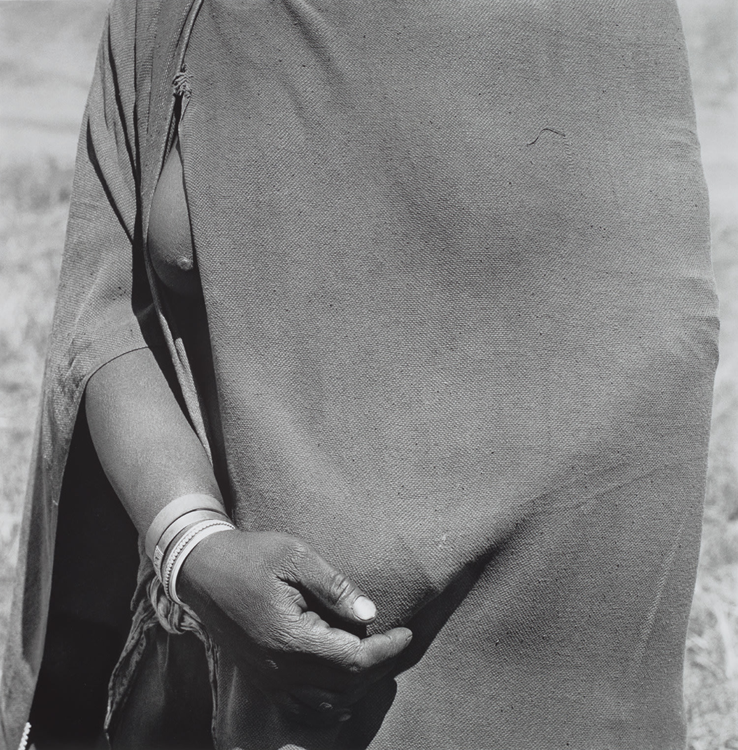 David Goldblatt — Woman going to the trading store holding money under her blanket, near Flagstaff, Transkei