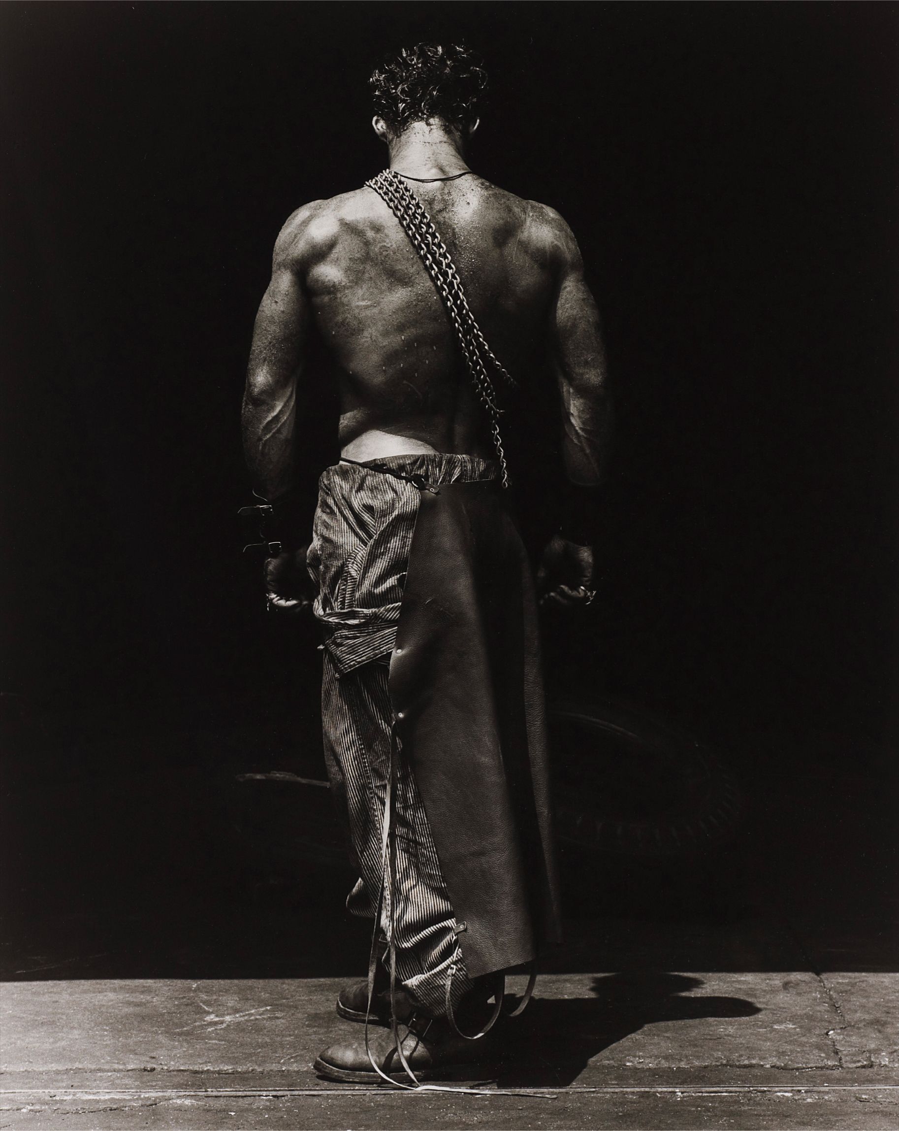 Herb Ritts — Fred, back view with chain, Hollywood from The Body Shop