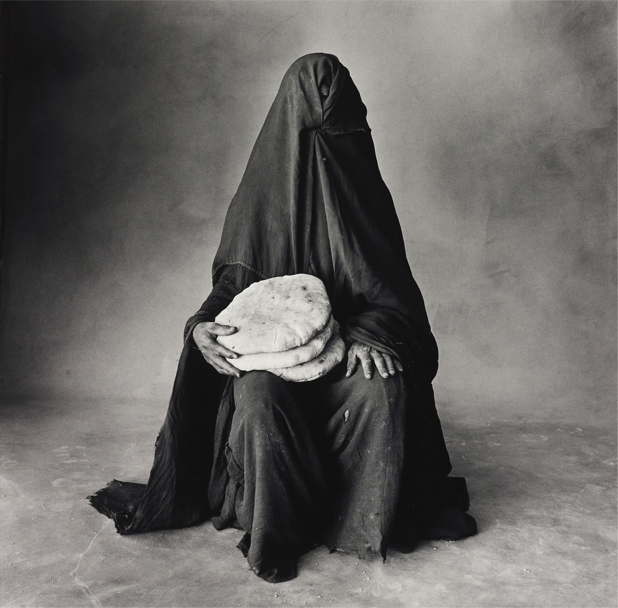 Irving Penn — Woman with three loaves, Morocco (B)