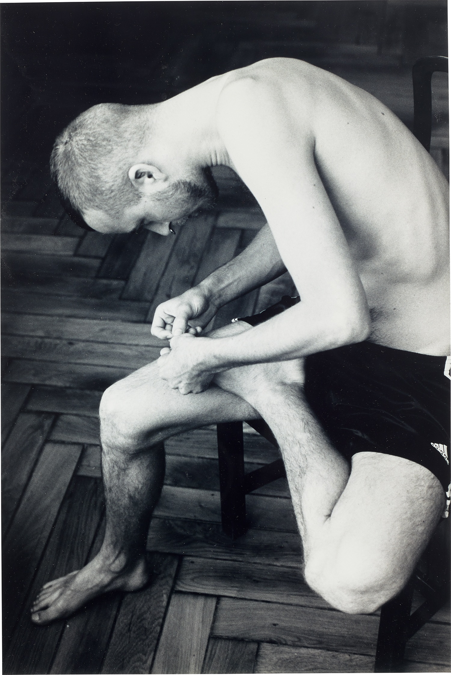 Wolfgang Tillmans — Anders pulling splinter from his foot (b/w)