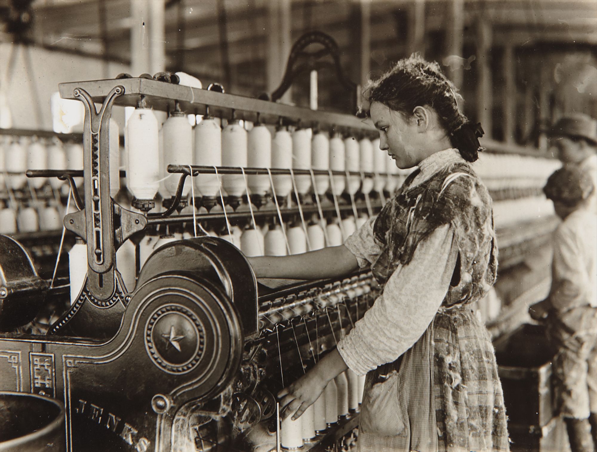 Lewis Hine — Spinner in Vivian Cotton Mills, Cherryville, N.C. Been at it 2 years. Where will her good looks be in ten years? Location: Cherryville, North Carolina, November
