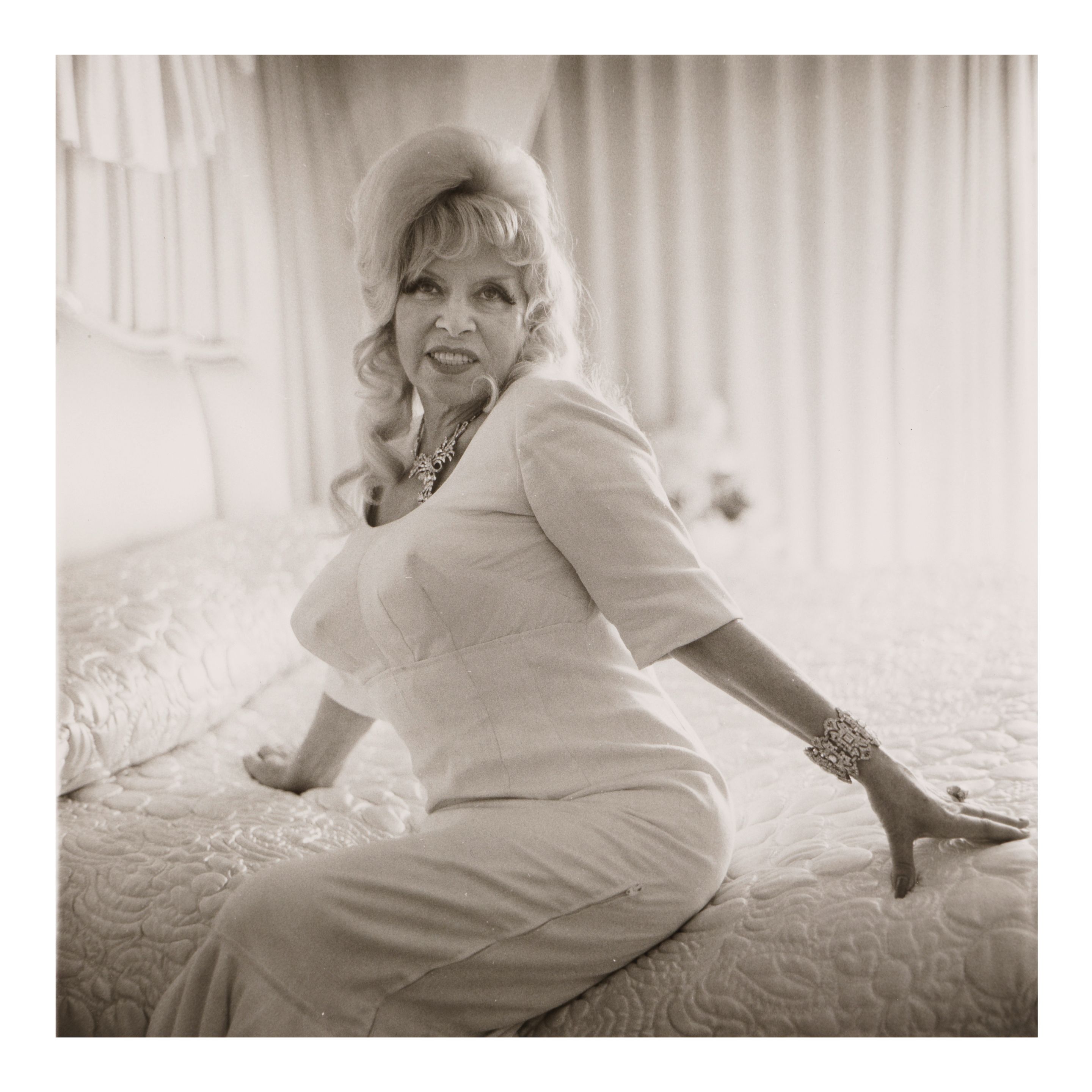 Diane Arbus — Mae West on her bed, Santa Monica, CA