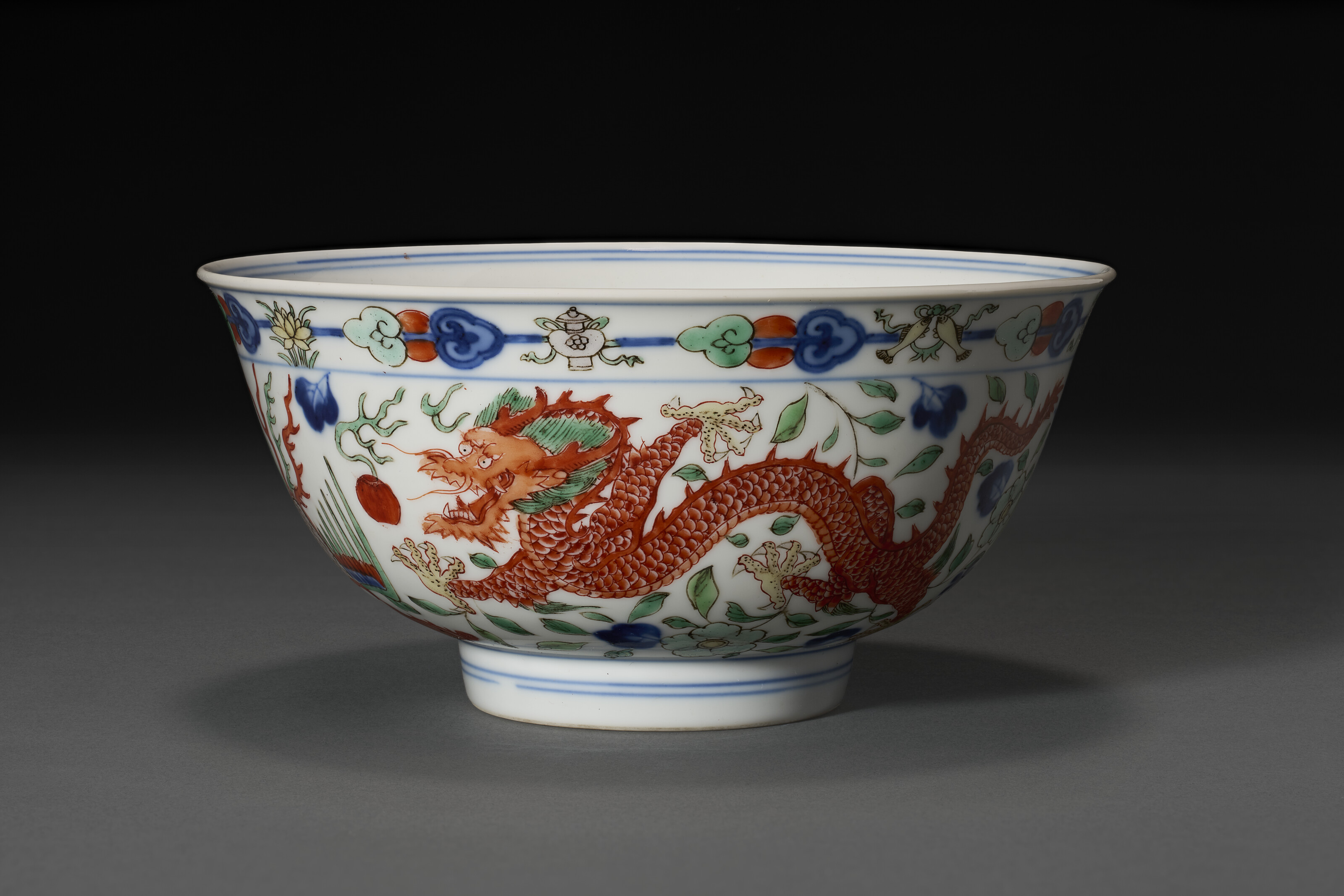 A Wucai 'dragon And Phoenix' Bowl — QIANLONG SEAL MARK IN UNDERGLAZE BLUE AND OF THE PERIOD (1736-1795)