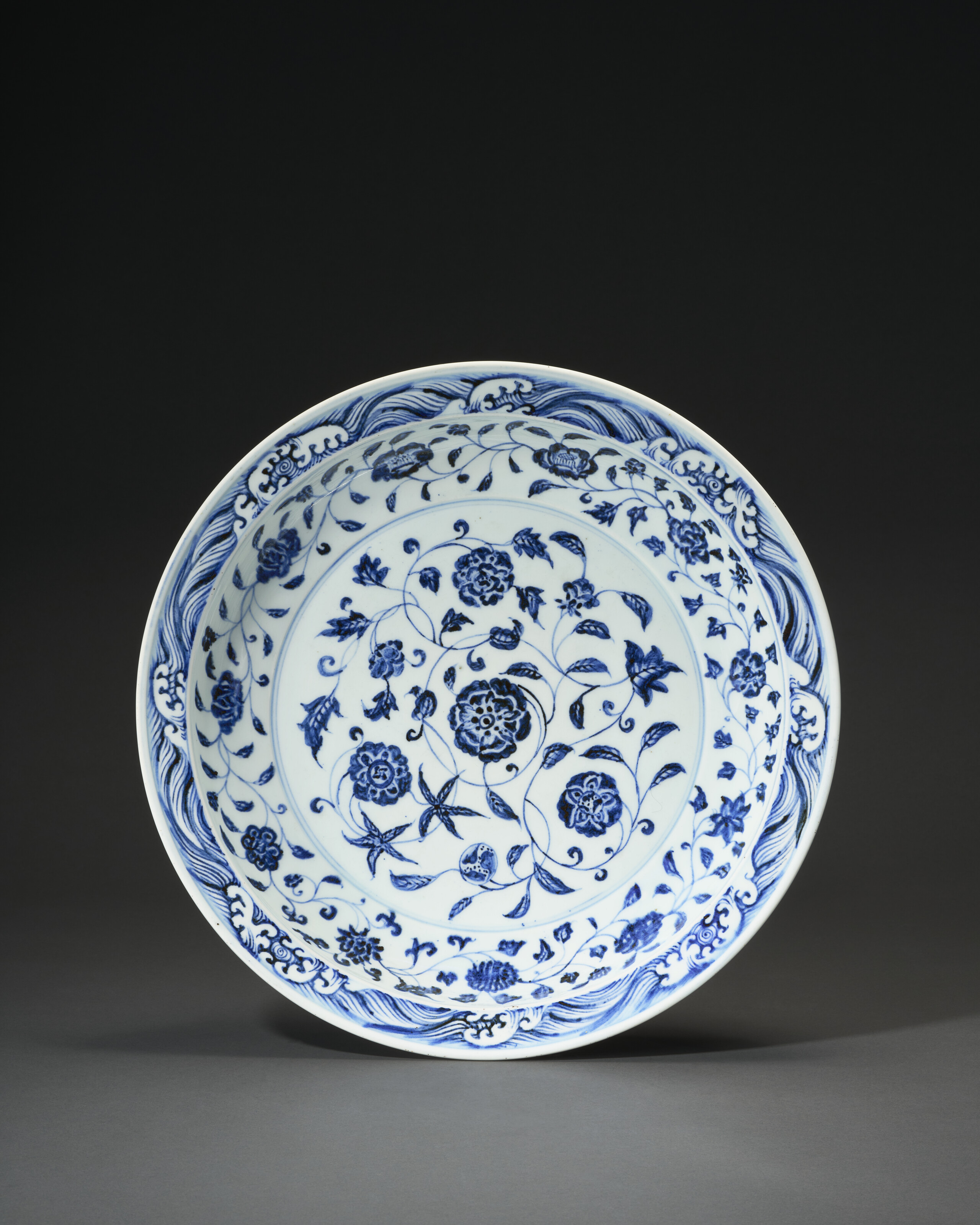 A Large Blue And White 'floral Scroll' Dish — YONGLE PERIOD (1403-1424)