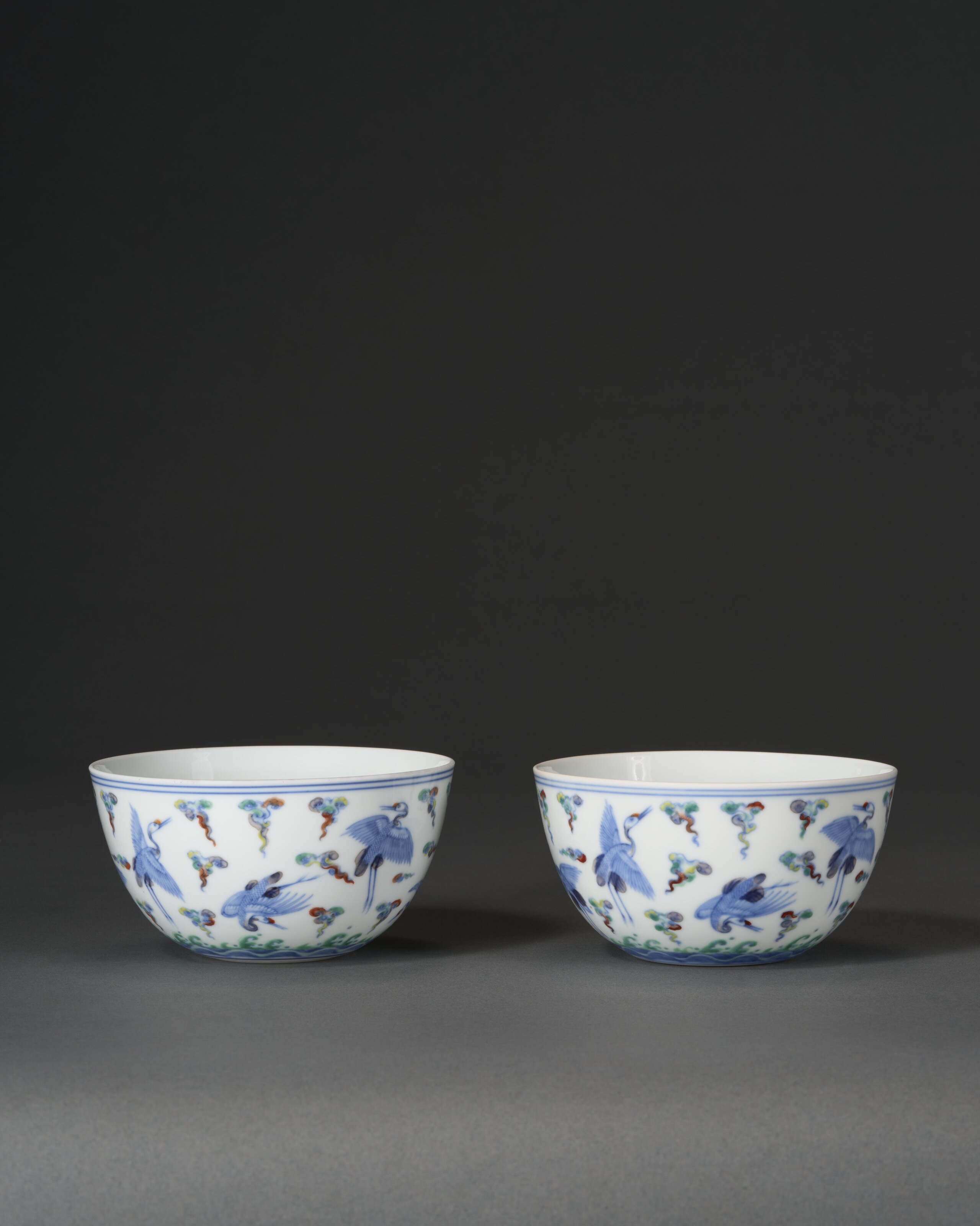 A Very Rare Pair Of Doucai 'crane' Bowls — YONGZHENG SIX-CHARACTER MARKS IN UNDERGLAZE BLUE WITHIN DOUBLE CIRCLES AND OF THE PERIOD (1723-1735)