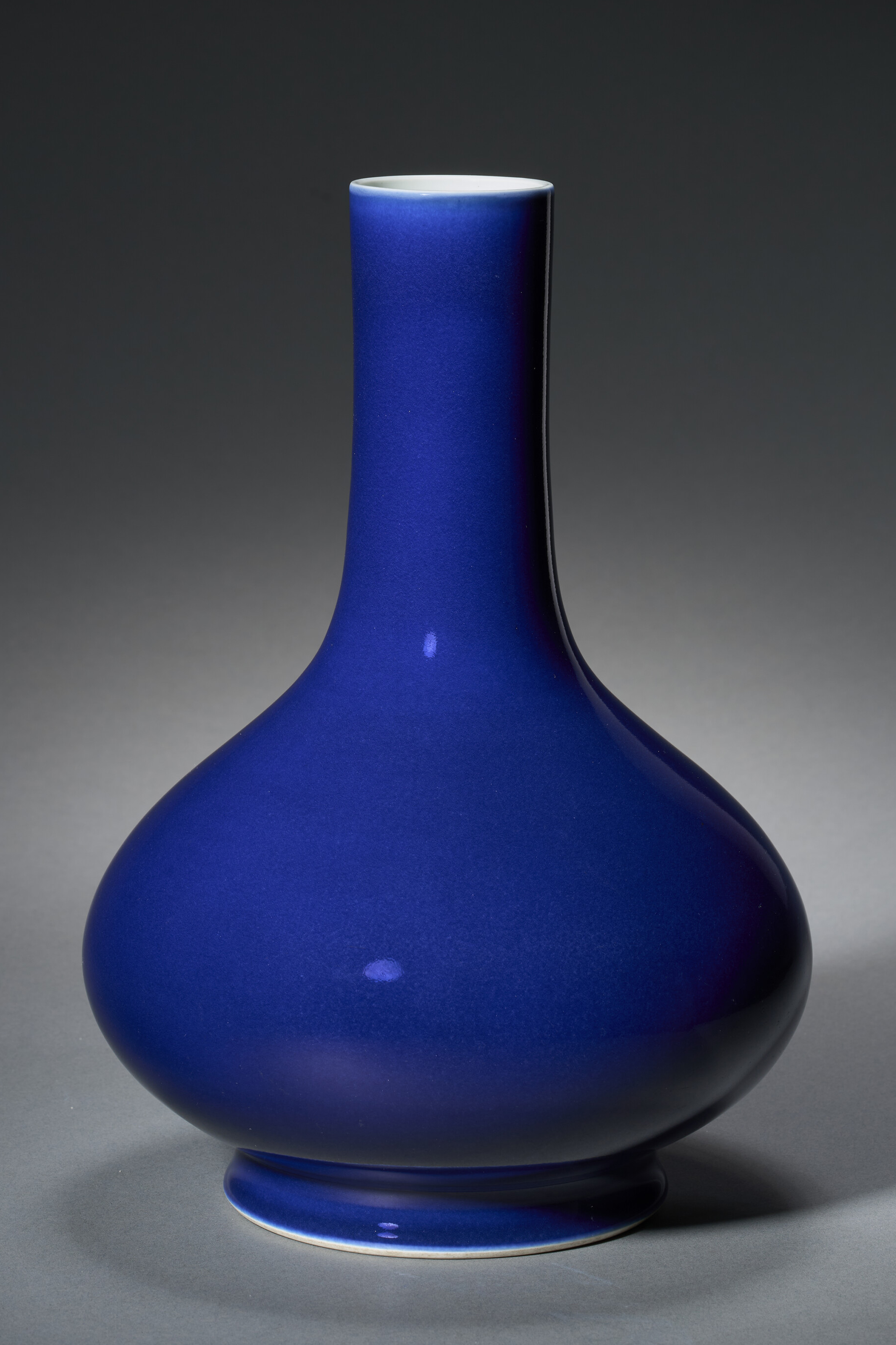 A Rare Sacrificial-blue-glazed Long-necked Vase — QIANLONG SEAL MARK IN UNDERGLAZE BLUE AND OF THE PERIOD (1736-1795)