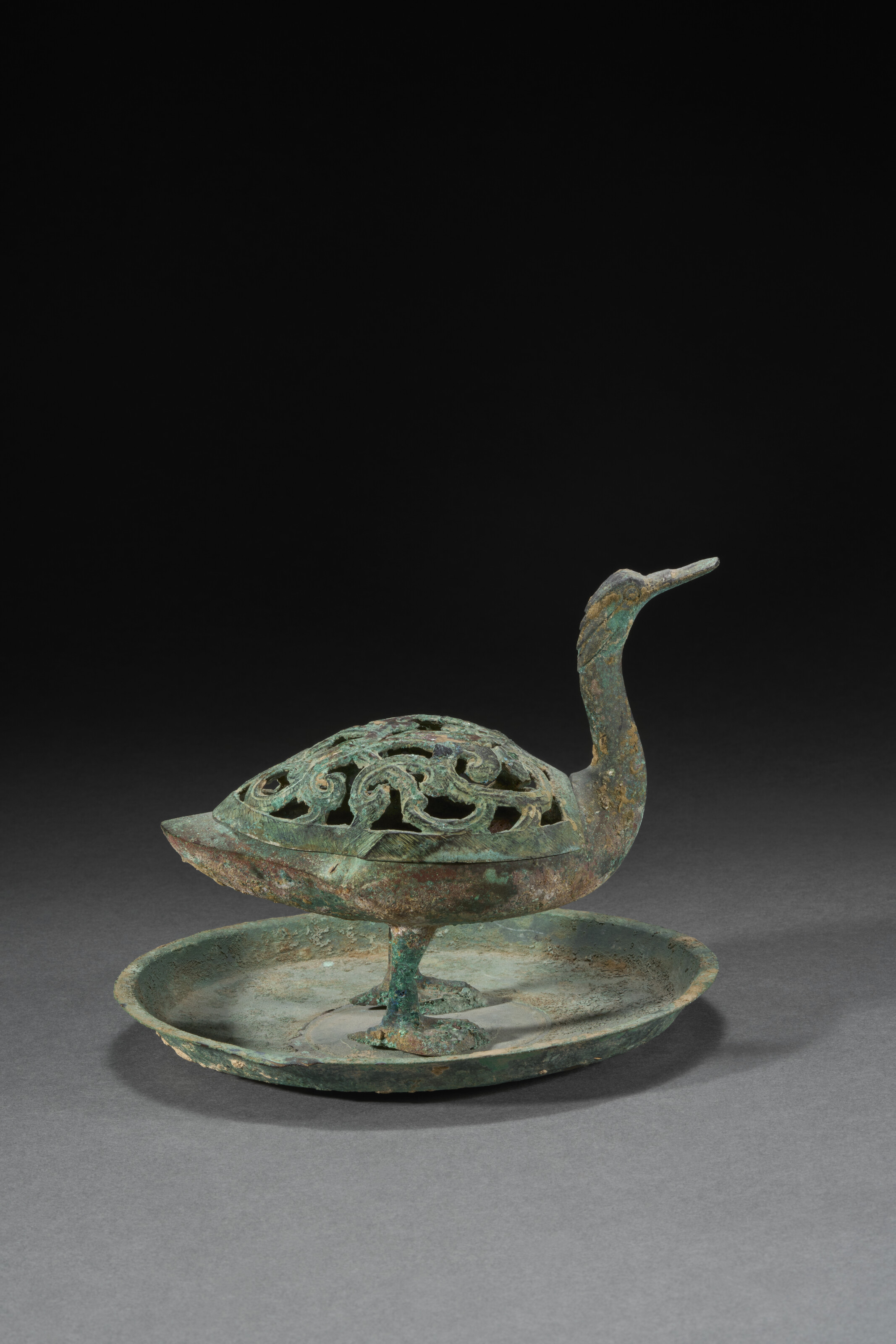 A Bronze Duck-form Censer And Reticulated Cover — HAN DYNASTY (206 BC- AD 220)