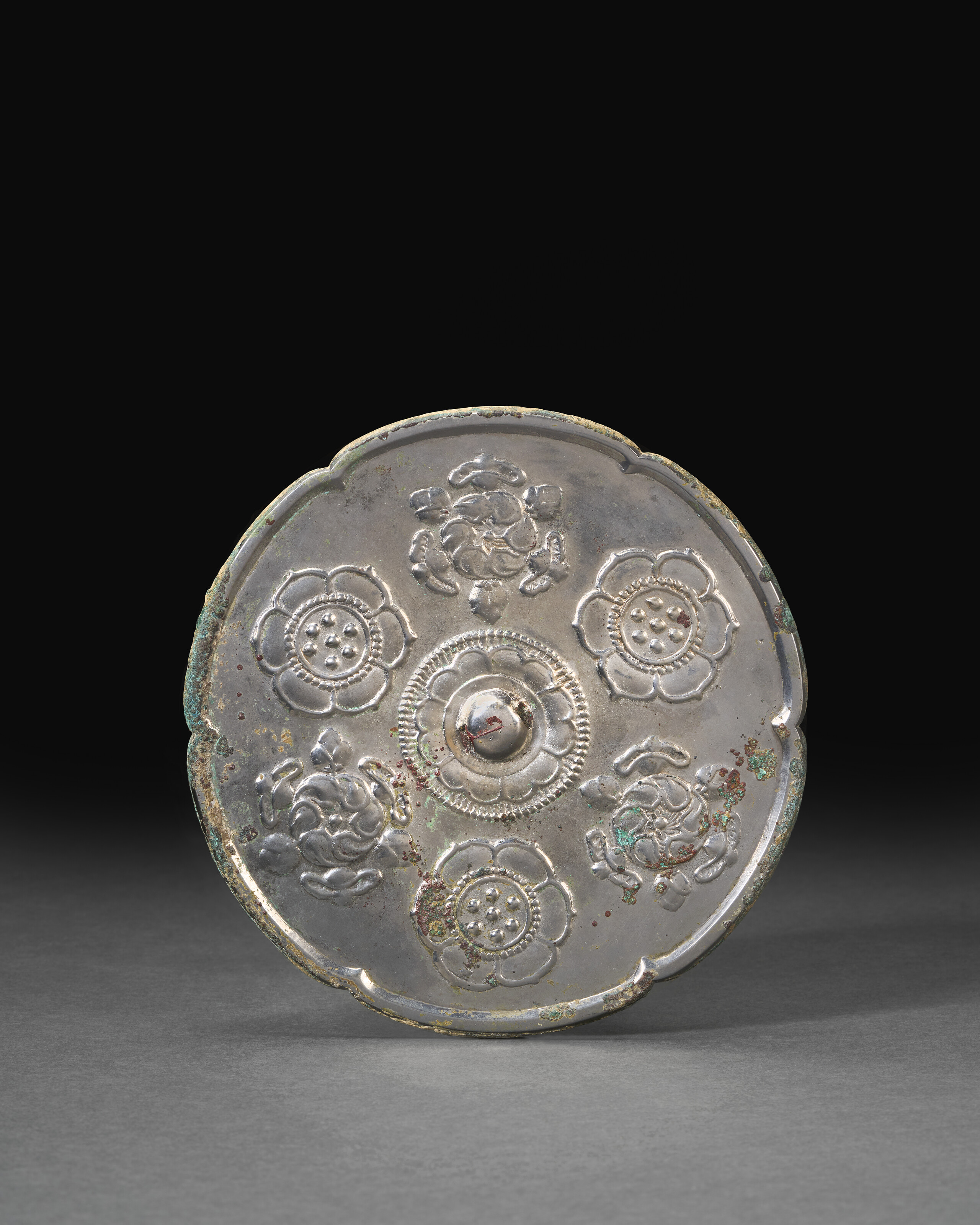 A Silvery-bronze Lobed 'lotus' Mirror — TANG DYNASTY (AD 618-907)