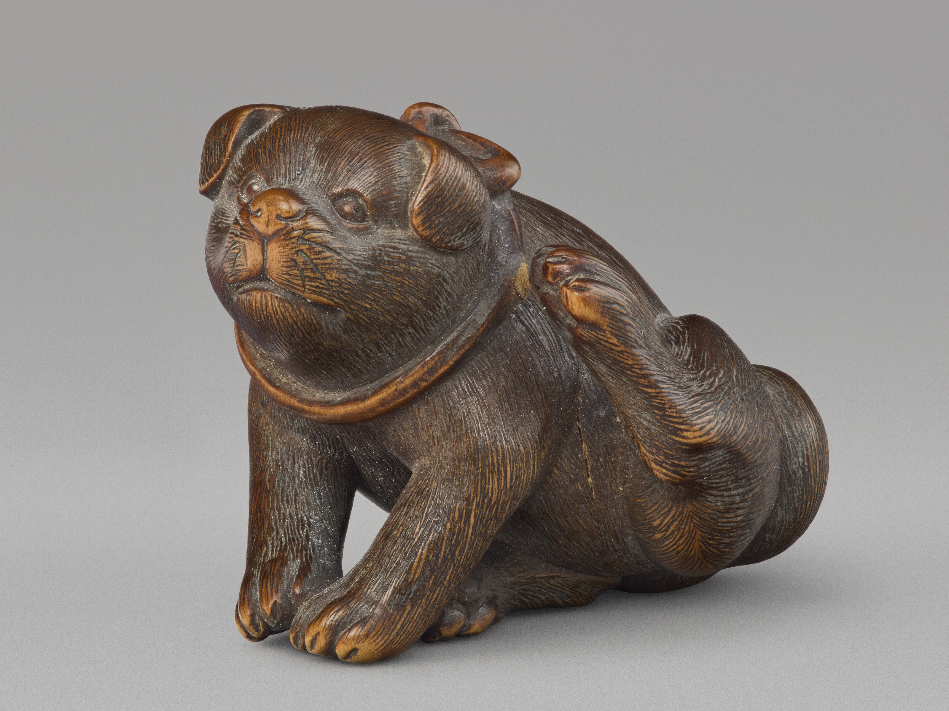 A Carved Wood Netsuke Miniature Sculpture Of A Dog — EDO PERIOD (19TH CENTURY), SIGNED MASANAO