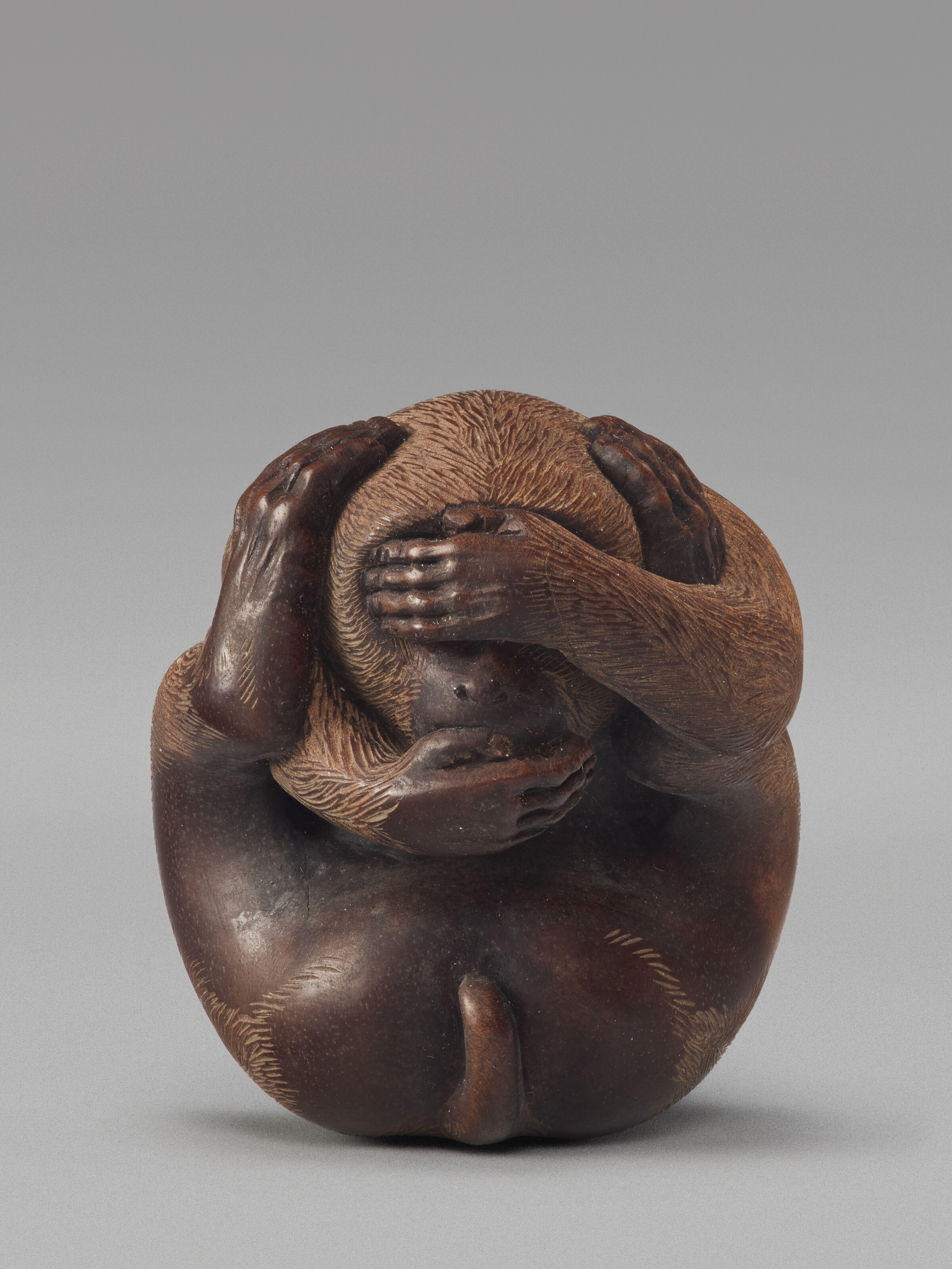 A Carved Wood Netsuke Miniature Sculpture Of A Monkey — SHOWA PERIOD (20TH CENTURY), SIGNED SOSUI (OUCHI SOSUI; 1911-1972)