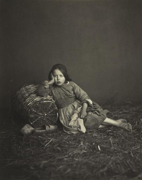 Young Girl Seated on Straw, Leaning on a Basket