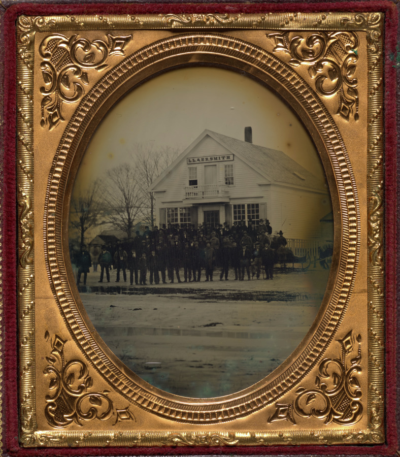 Unknown Artist — Crowd with sleigh in front of LL & ER Smith store